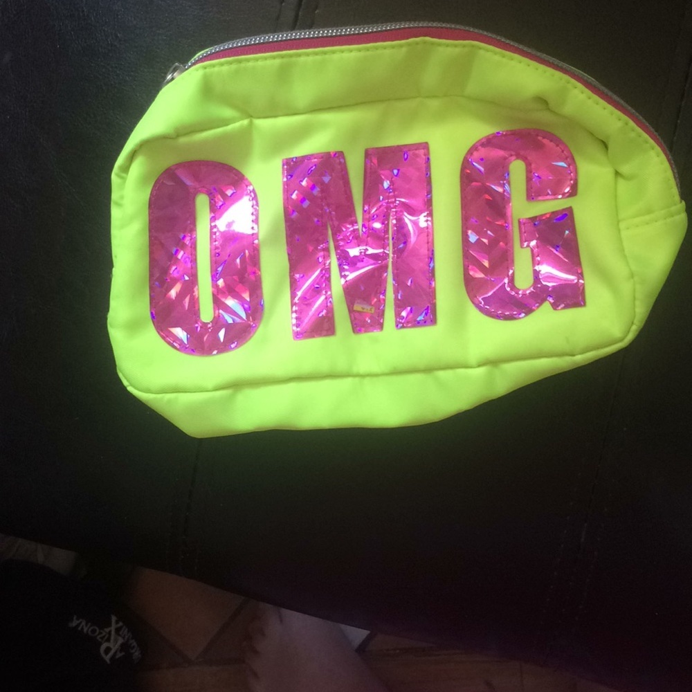 O m g makeup purse